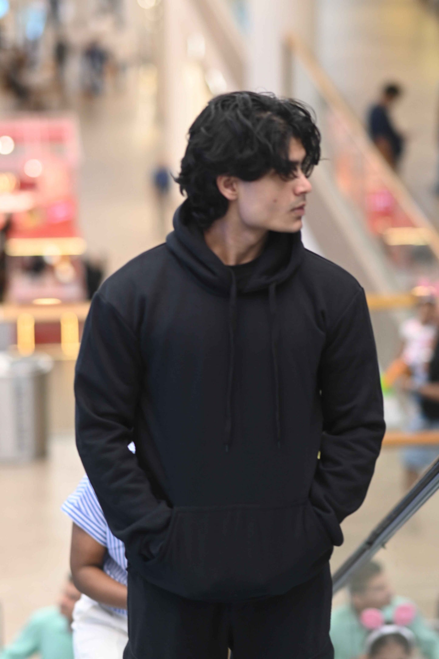 Stylish black Eternal hoodie with a relaxed fit and front pocket, perfect for casual outings