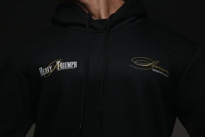 Black Heavy Triumph Hoodie featuring Stylized Logo for Comfortable Casual Wear
